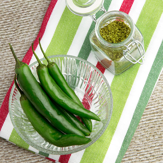 DIY Dehydrated Green Chilli Powder @OmNomAlly #Raw option, #glutenfree, #paleo, #vegan. Green chilli powder is one of those ingredients you'll hardly ever see in the shops - so just make your own! Packing a vibrant, spicy punch, try this Home-made Green Chilli Powder in your dehydrator.