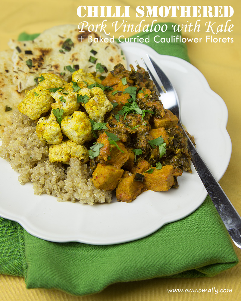 Chili Smothered Pork Vindaloo with Kale + Baked Curried Cauliflower Florets | A fiery-hot pork dish, this amazing Goan-style vindaloo curry is made by smothering the pieces of meat in a homemade garlic-chilli sauce before braising until tender. @omnomally