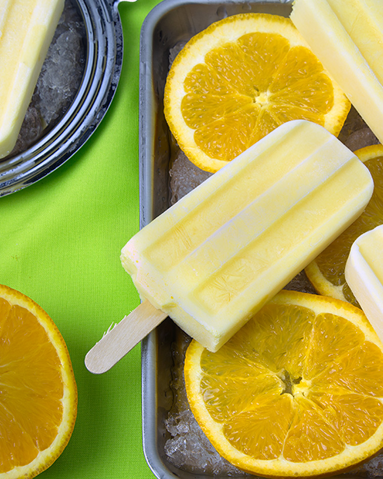 Orange Creamsicle Pops (Vegan, Paleo) @OmNomAlly | Unlike packaged Creamsicles, these creamy orange popsicles have five easy to find, easy to pronounce, nourishing ingredients - with no CRAP!